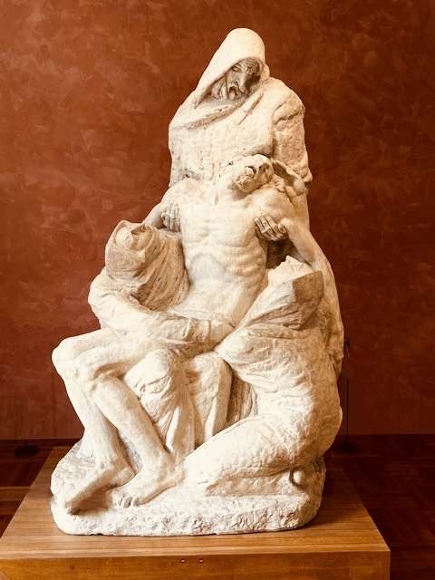 Sculpture of three figures holding Jesus' body by sculptor Ivan Meštrović